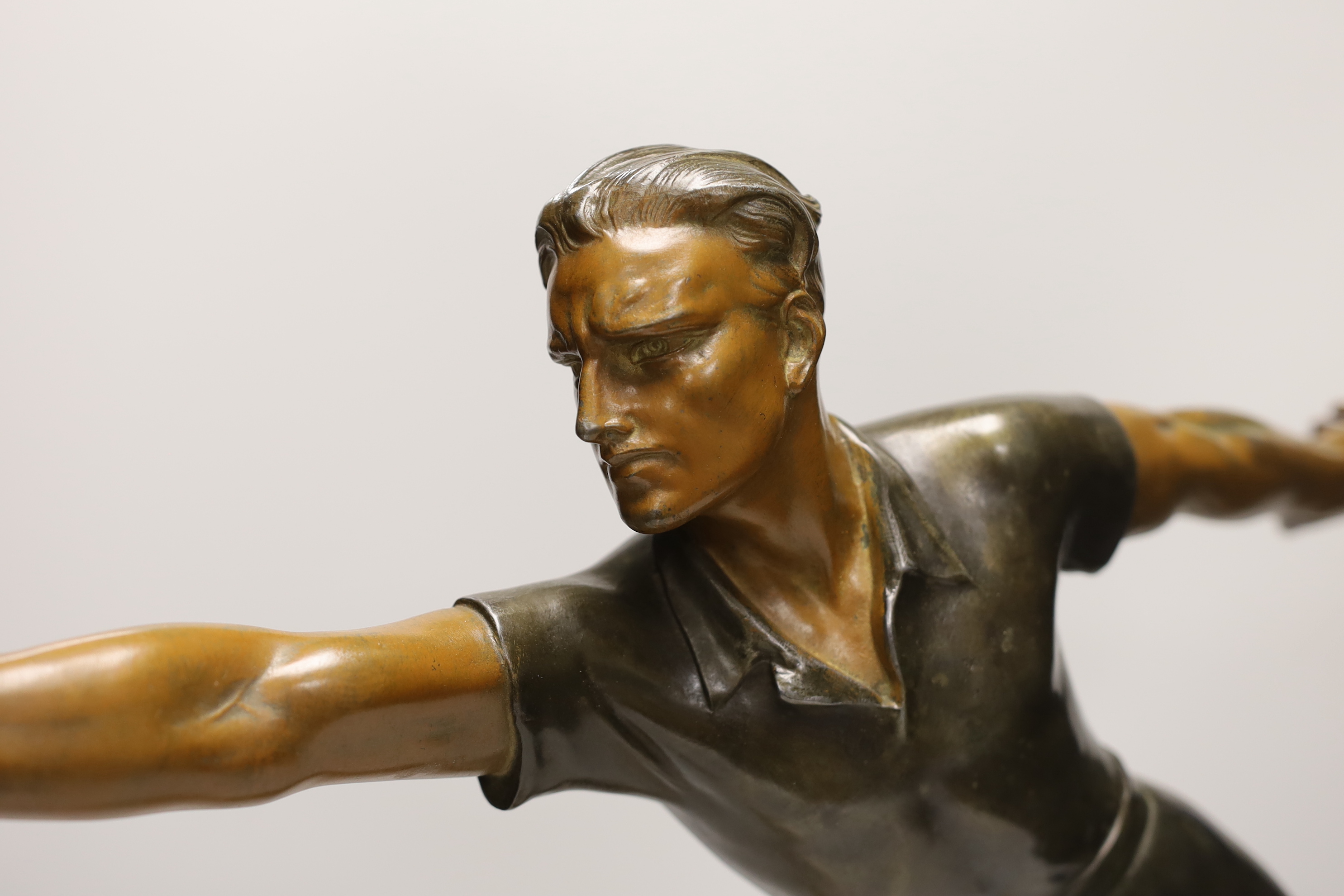 A French Art Deco spelter figure 'Petanque player' 60cm wide, 50cm high